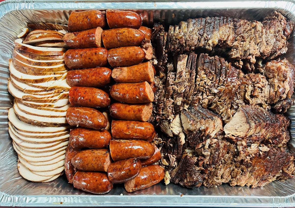 BBQ meat platter with turkey, sausage and brisket